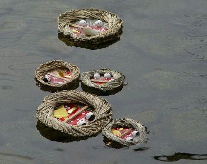 Photos of Hina Dolls in Boat for Hina Nagashi Matsuri