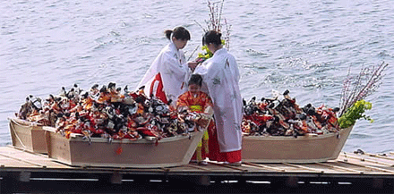 Photos of Hina Dolls in Boat for Hina Nagashi Matsuri